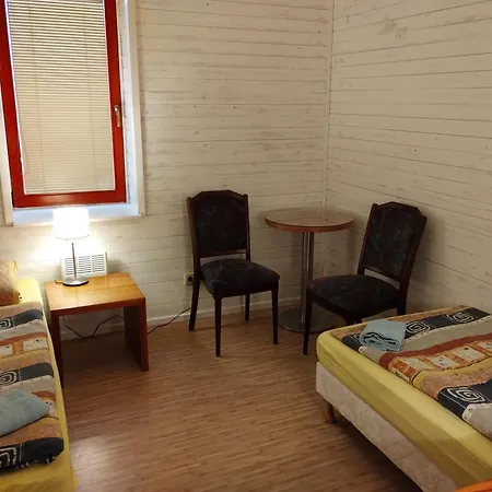 V Dřevěném Domě Apartmán *
